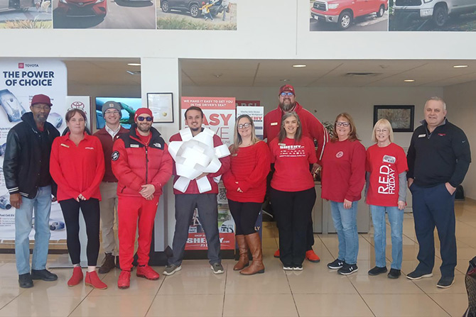 Group of workers in red at charity event