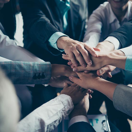 People with their hands together